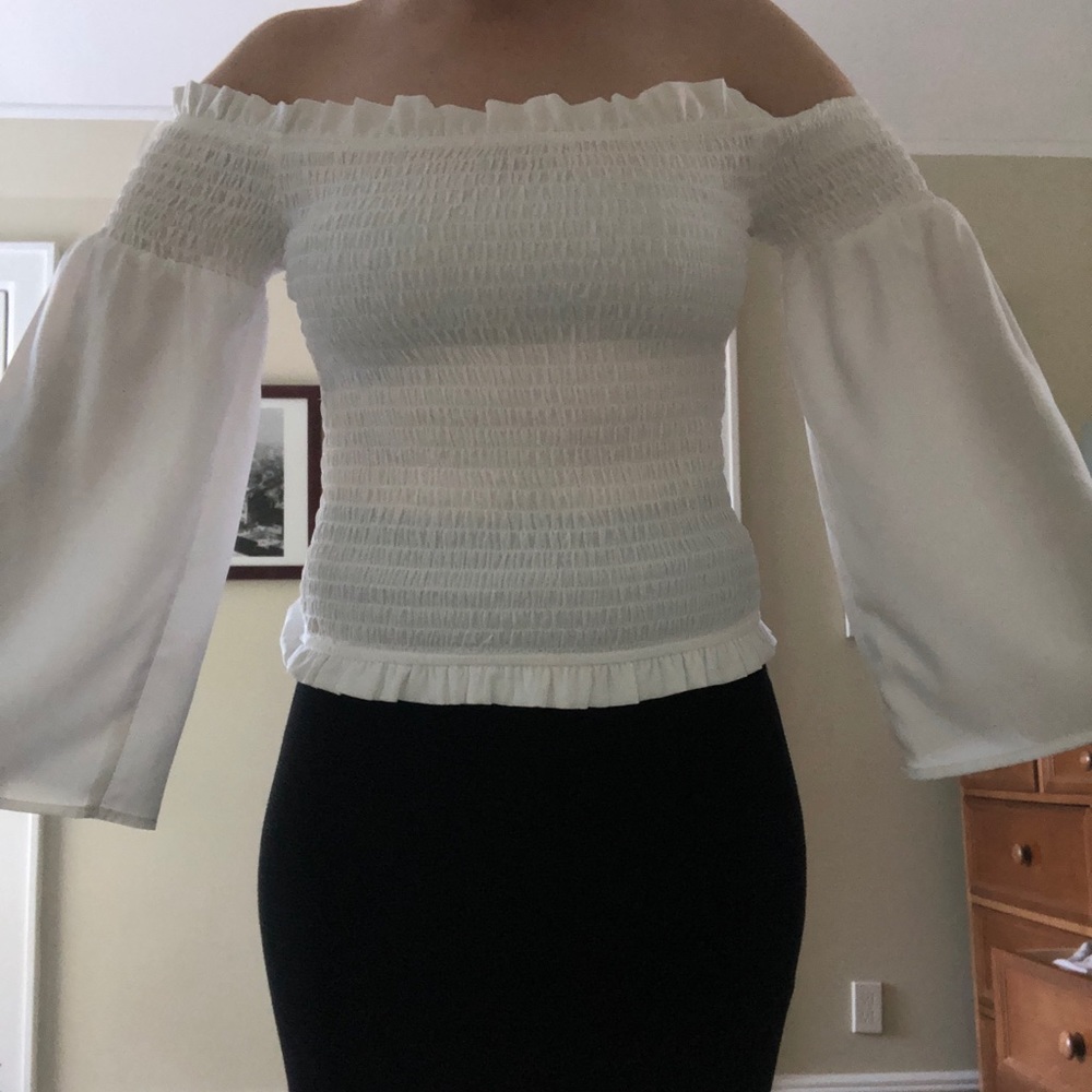 Tight black skirt, fitted white top flowy arms